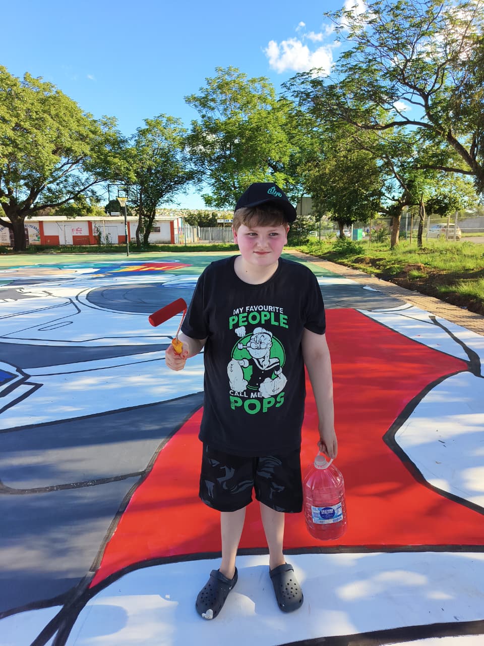 Cayden painting outdoors in South Africa
